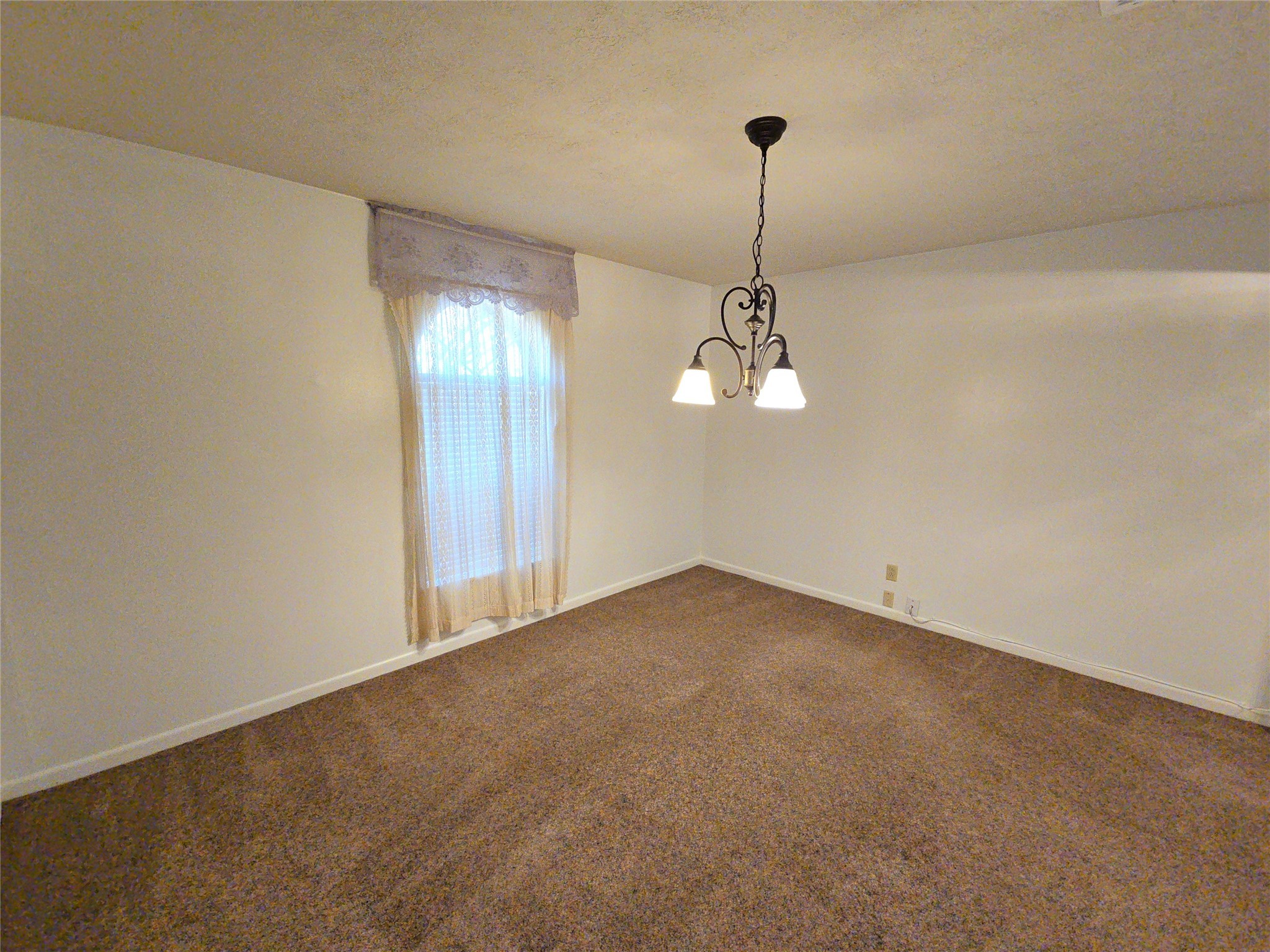 1206 Crescent Boulevard Cleveland, TX 77327 - Photo 19 of 33 a view of a room with a chandelier fan and windows