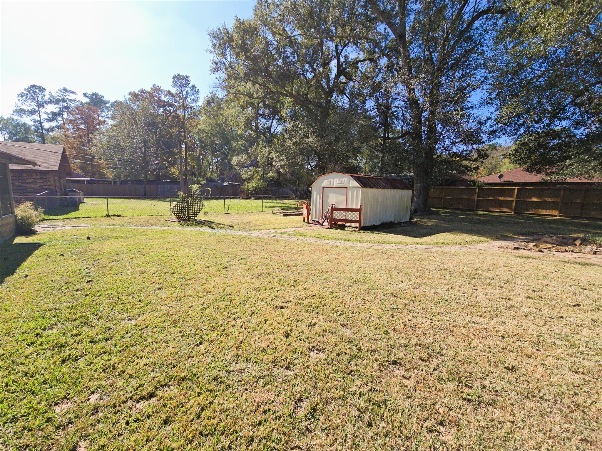 1206 Crescent Boulevard Cleveland, TX 77327 - Photo 2 of 33 a view of a swimming pool with an outdoor space and seating area