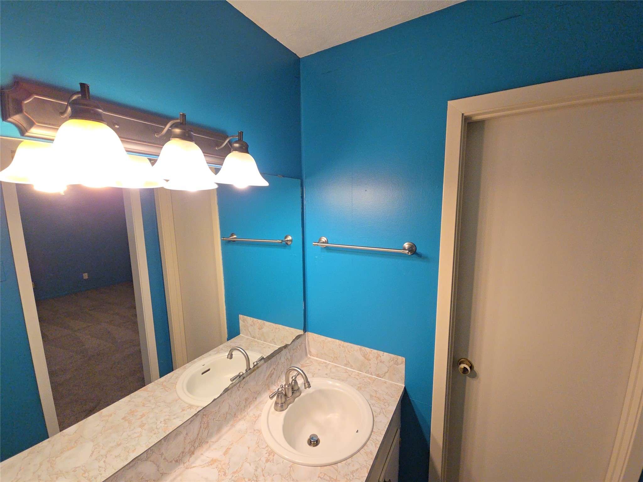 1206 Crescent Boulevard Cleveland, TX 77327 - Photo 22 of 33 a bathroom with a sink and a mirror