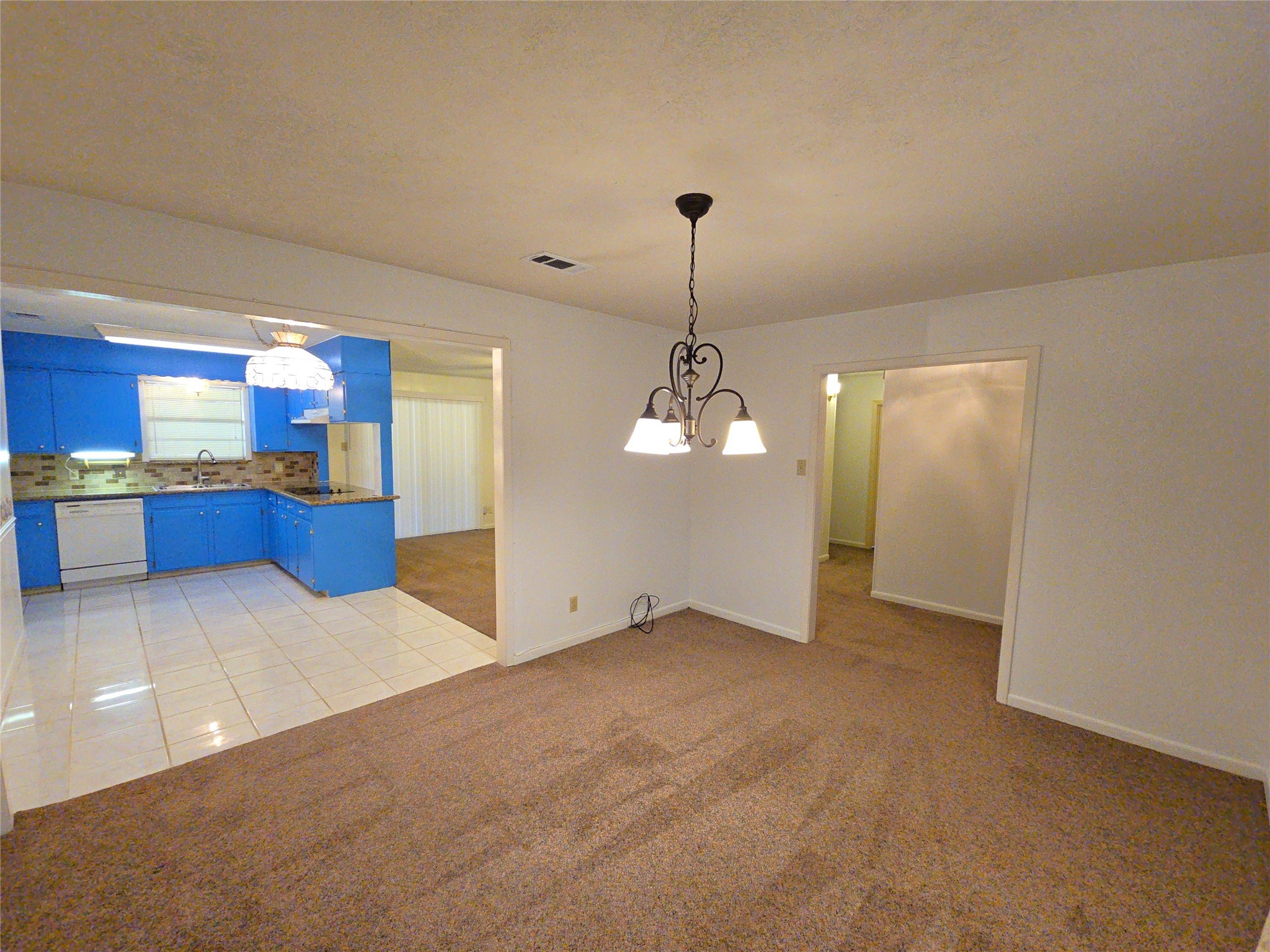 1206 Crescent Boulevard Cleveland, TX 77327 - Photo 3 of 33 a view of a kitchen with a sink and cabinets