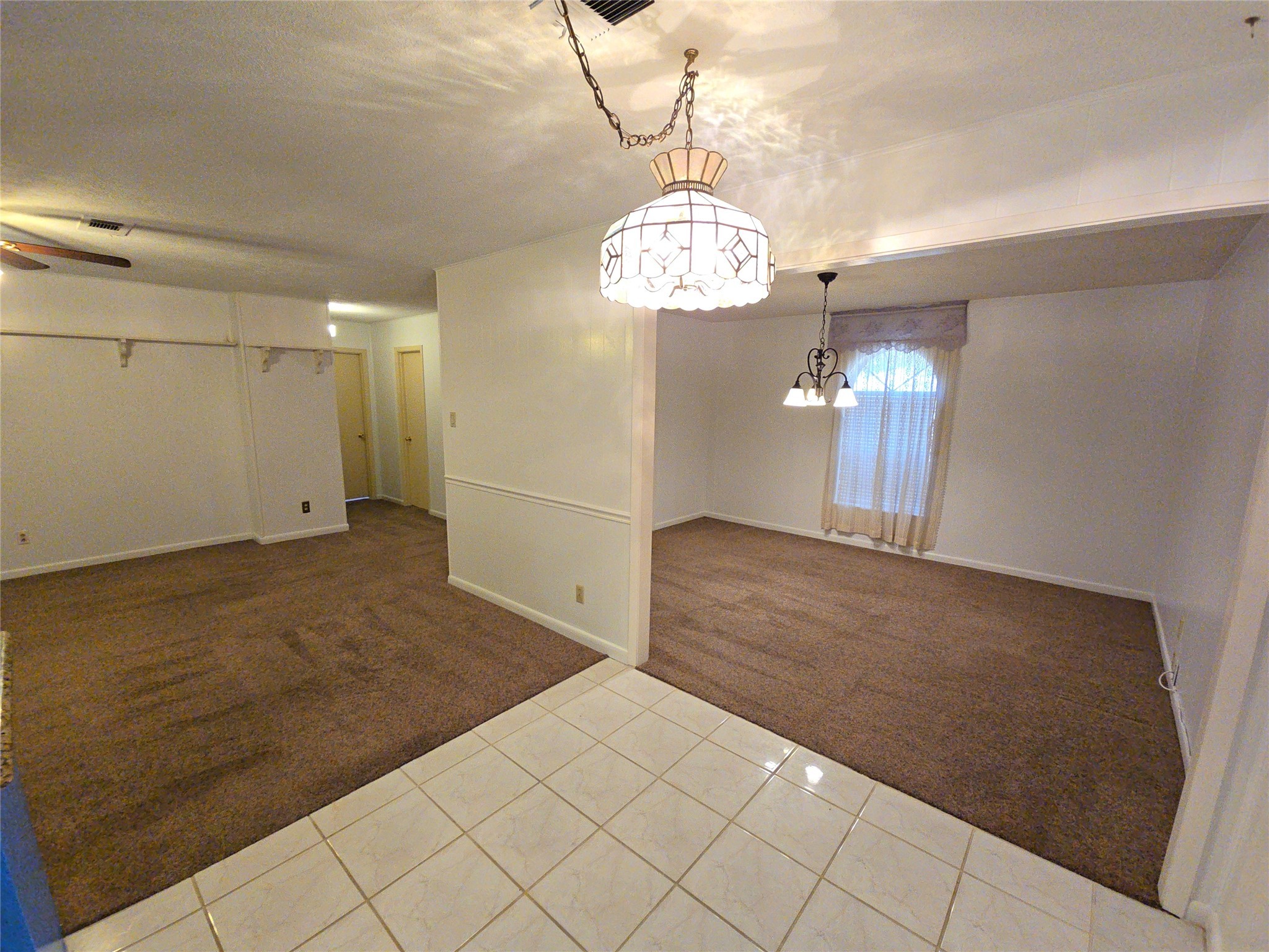 1206 Crescent Boulevard Cleveland, TX 77327 - Photo 4 of 33 a view of a chandelier and wooden floor in a room