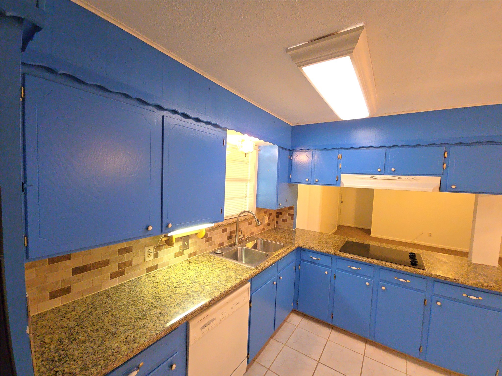 1206 Crescent Boulevard Cleveland, TX 77327 - Photo 8 of 33 a kitchen with stainless steel appliances granite countertop wooden cabinets a sink and dishwasher