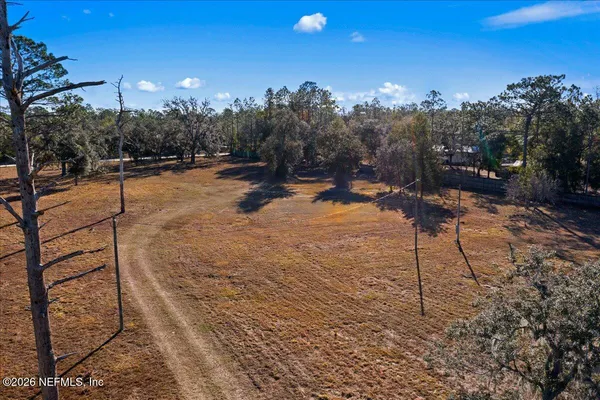a view of a backyard of the house