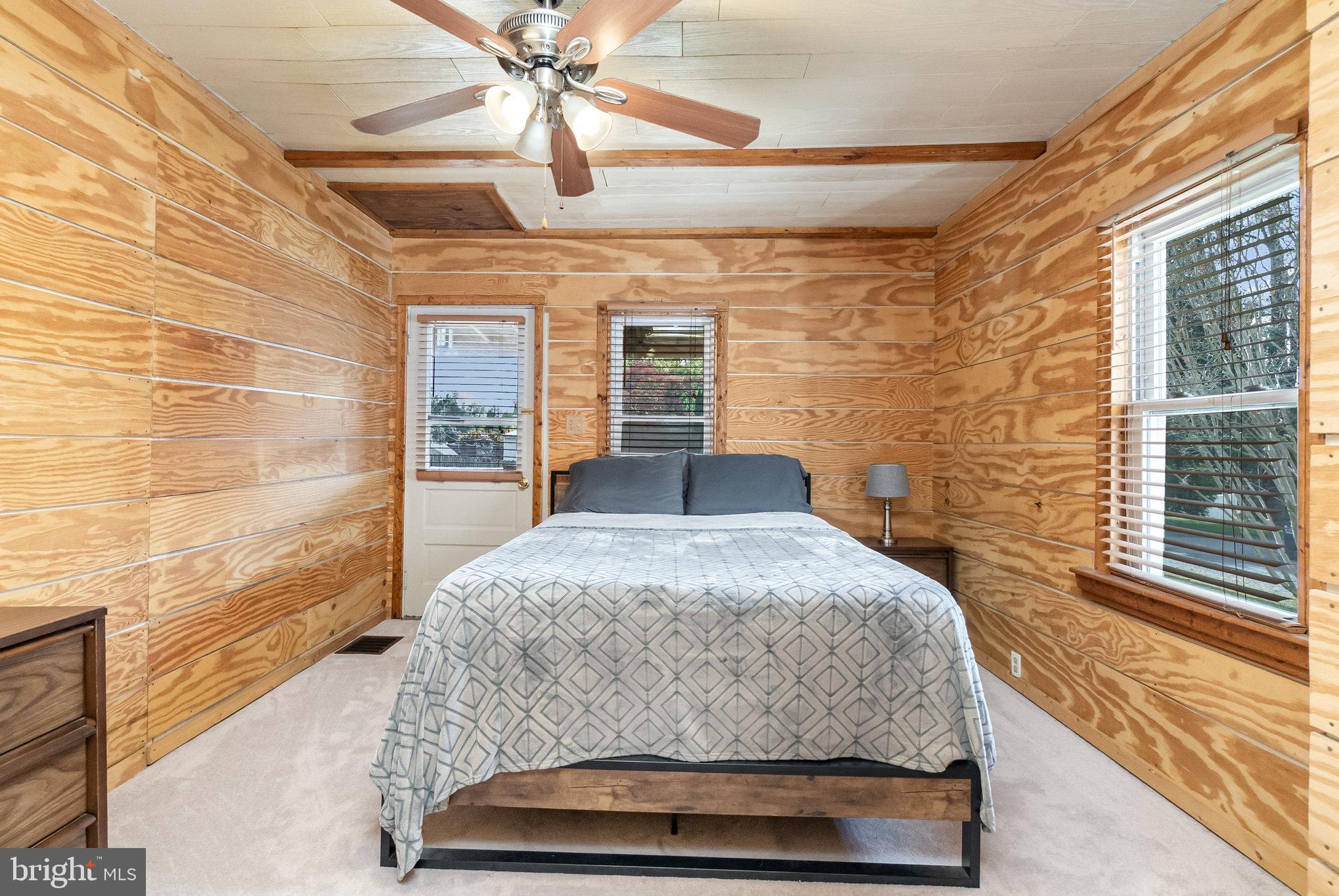 66 Spready Oak Road Rising Sun, MD 21911 - Photo 18 of 30 a bedroom with a bed and a chandelier