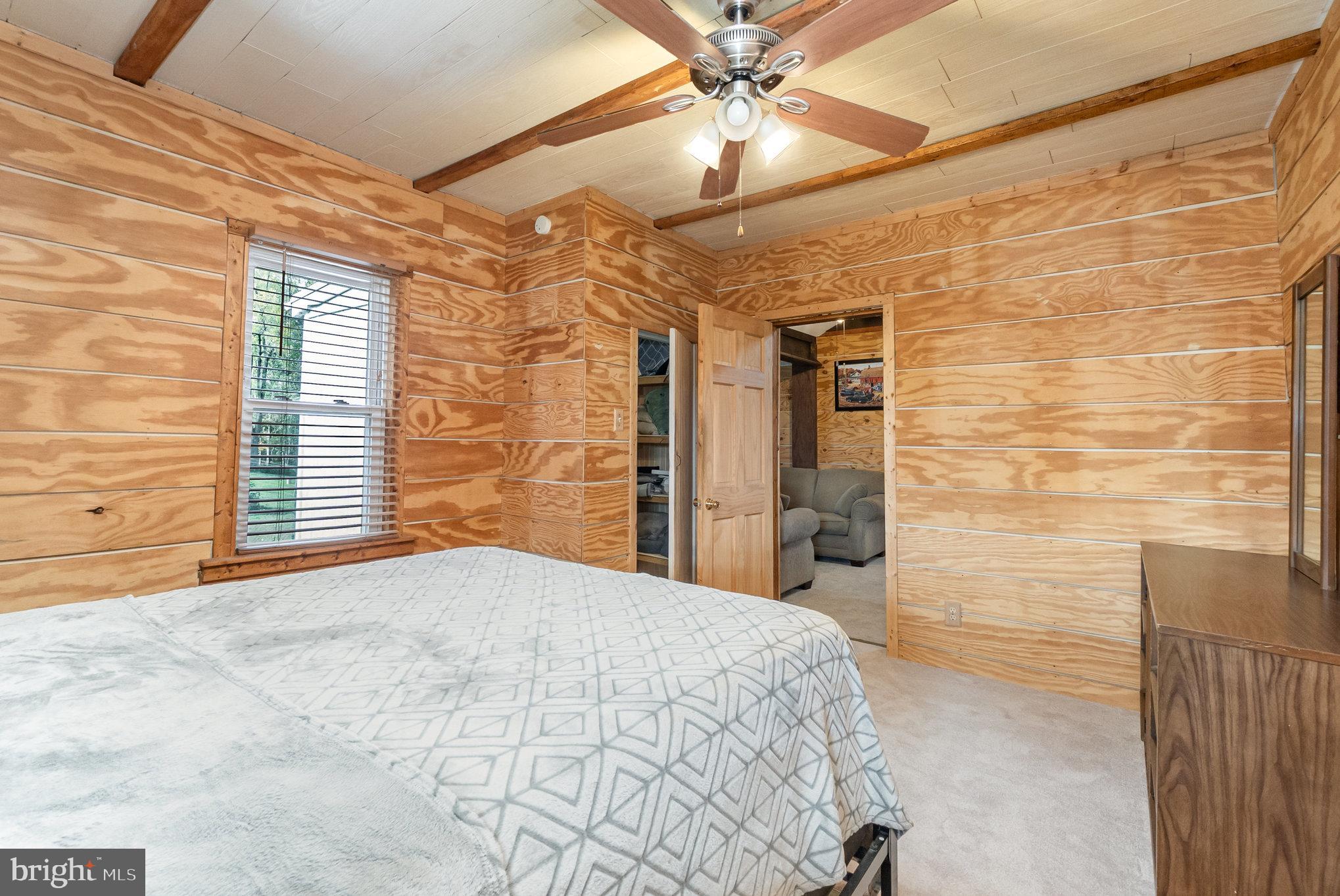 66 Spready Oak Road Rising Sun, MD 21911 - Photo 20 of 30 a bedroom with a bed and a chandelier