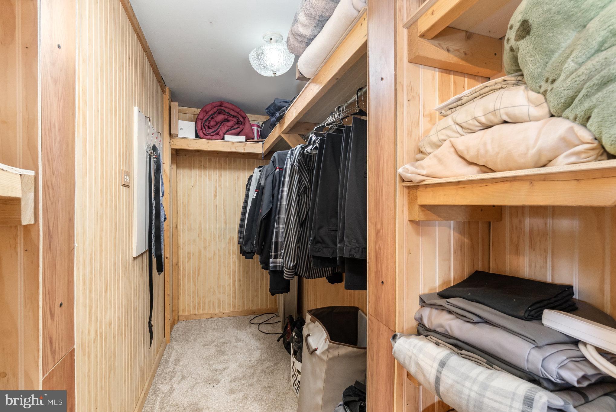 66 Spready Oak Road Rising Sun, MD 21911 - Photo 21 of 30 a view of walk in closet with clothes and shoes