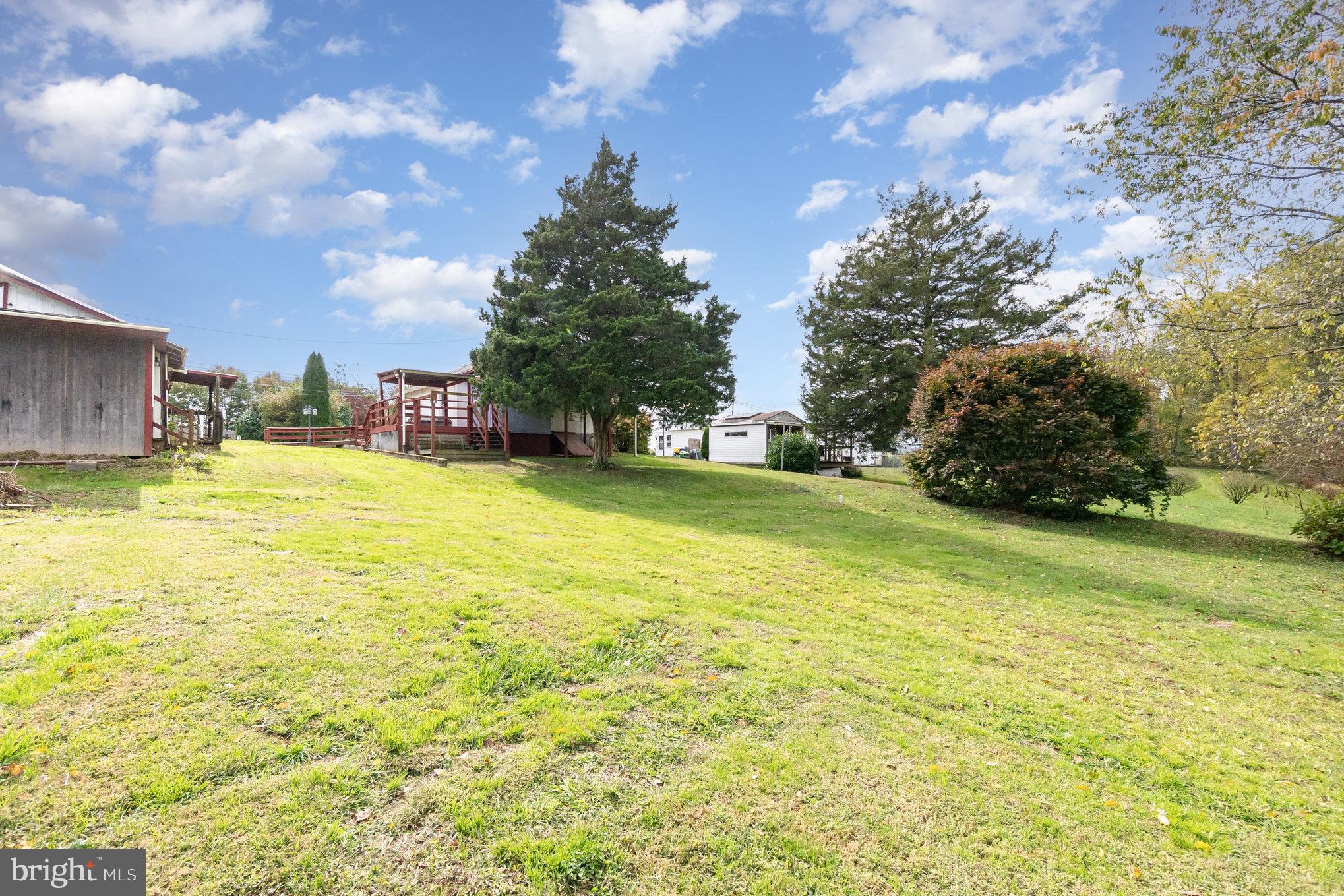 66 Spready Oak Road Rising Sun, MD 21911 - Photo 30 of 30 a view of a swimming pool with an outdoor space and seating area