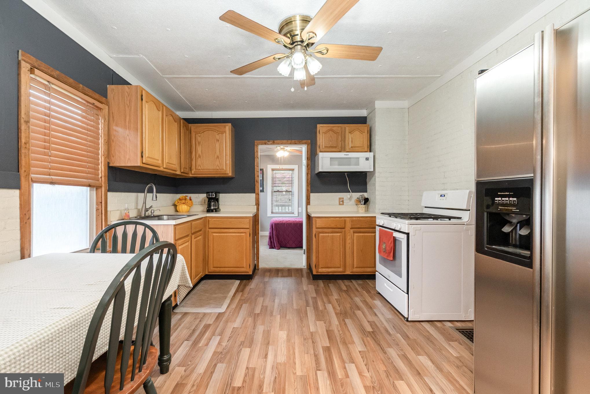 66 Spready Oak Road Rising Sun, MD 21911 - Photo 3 of 30 a kitchen that has a lot of cabinets a sink and appliances in it