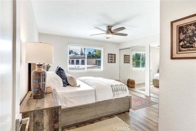 a bedroom with a large bed and a window