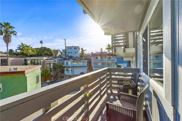 a view of balcony with a couple of chairs