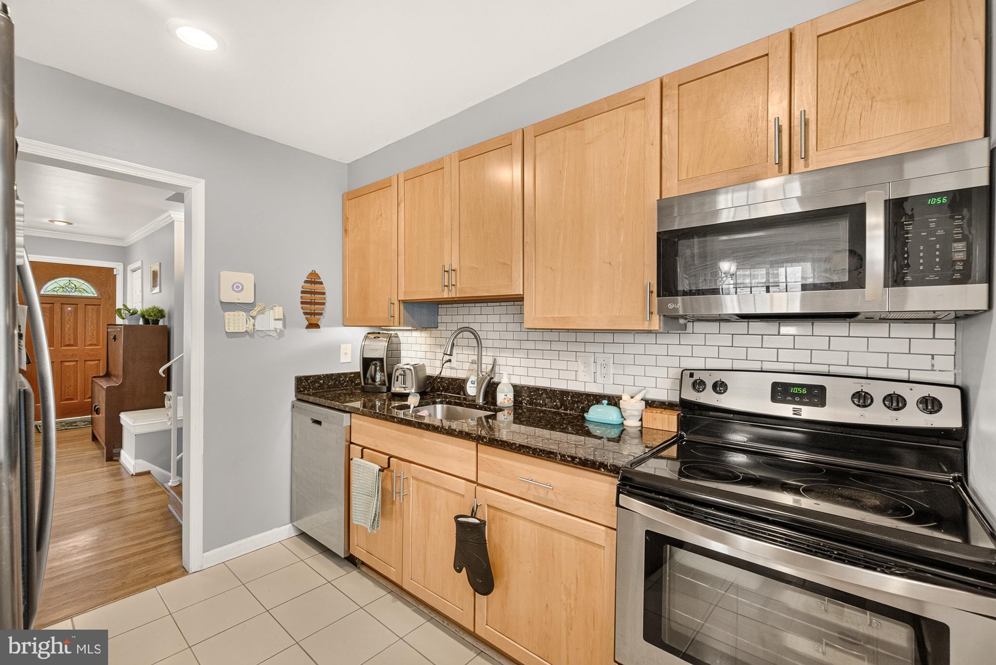 10202 Leslie Street Silver Spring, MD 20910 - Photo 15 of 44 Modern kitchen with sleek finishes.