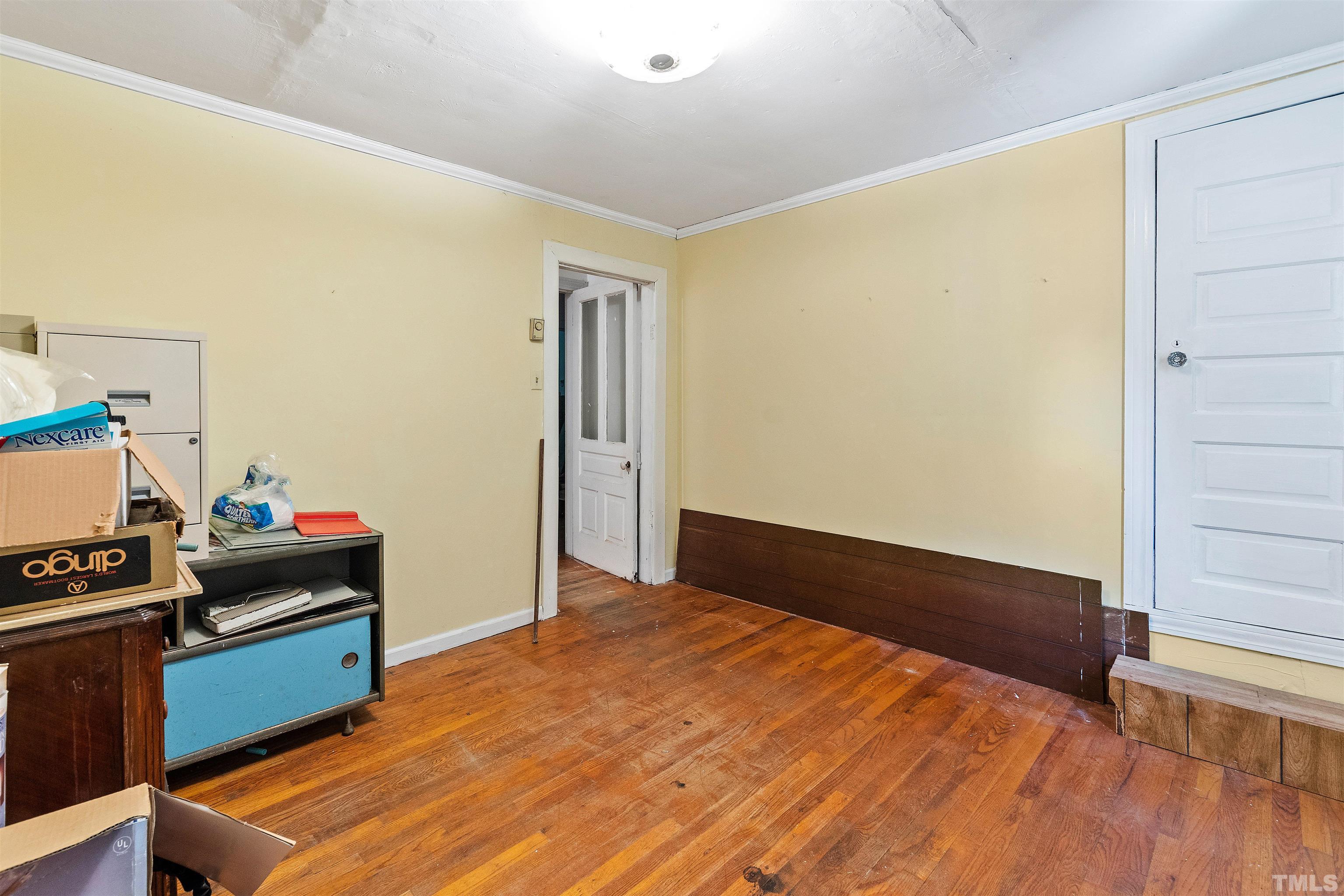 325 Maywood Avenue Raleigh, NC 27603 - Photo 11 of 30 a bedroom with a bed and a dresser