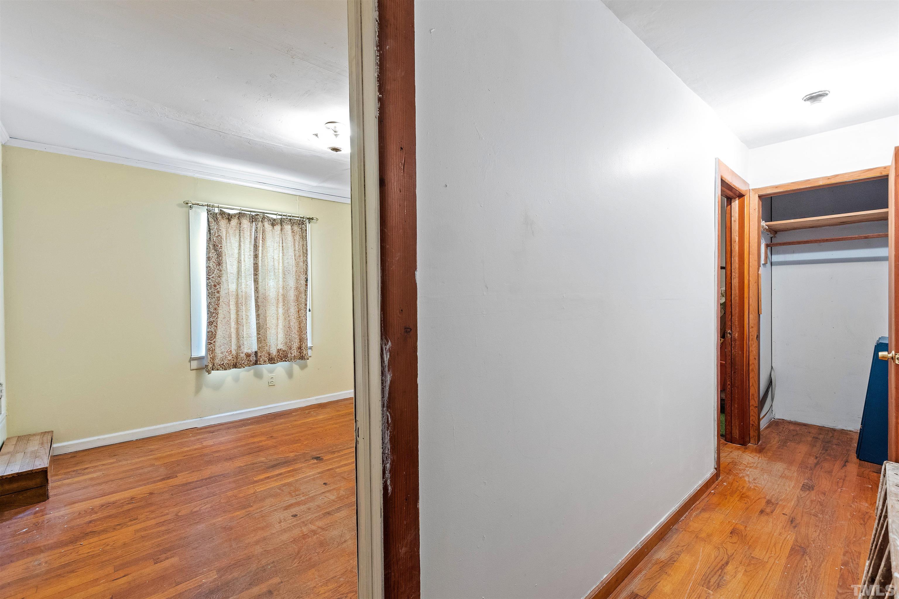 325 Maywood Avenue Raleigh, NC 27603 - Photo 17 of 30 a view of a room with wooden floor and windows