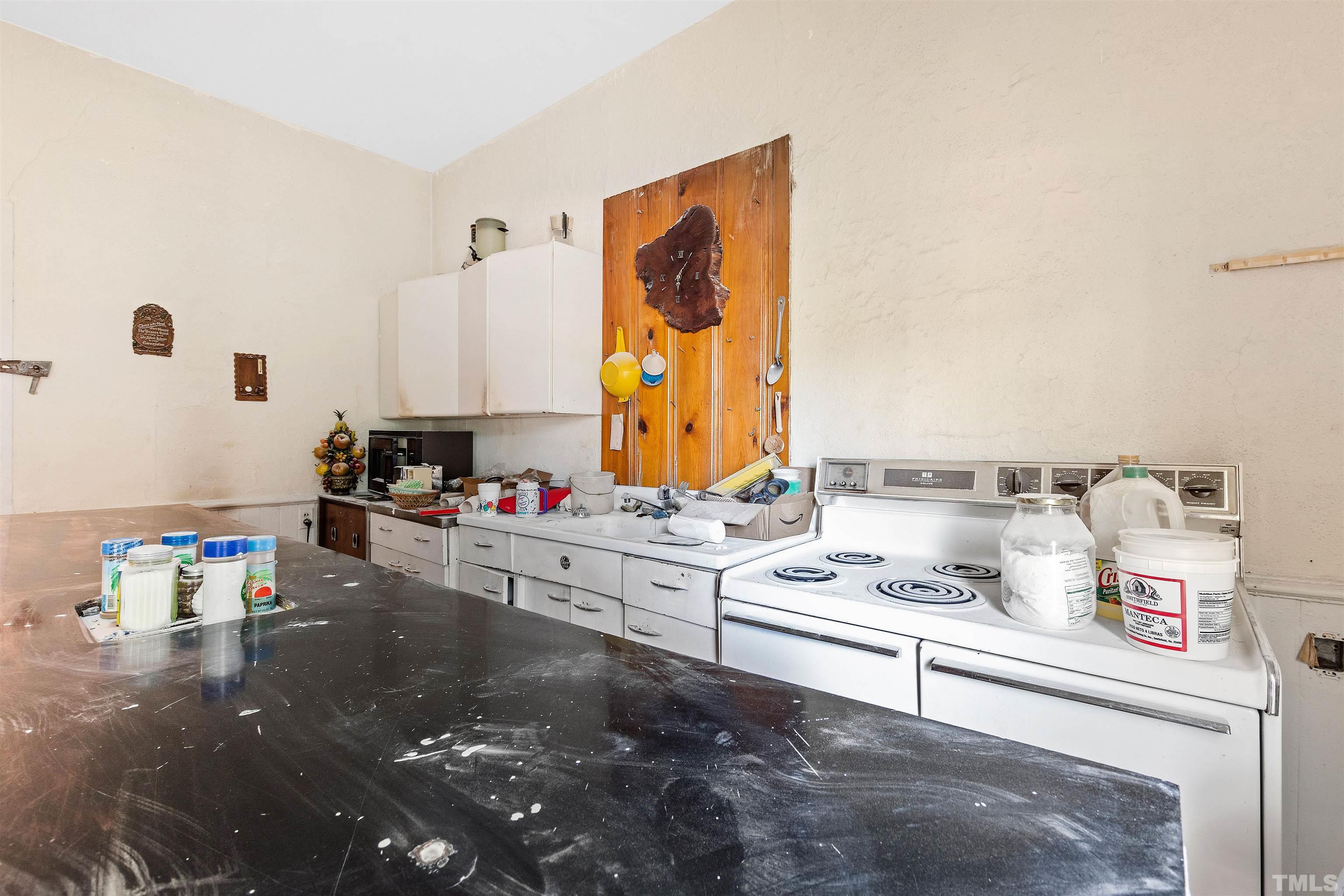 325 Maywood Avenue Raleigh, NC 27603 - Photo 20 of 30 a kitchen with a refrigerator and a stove top oven