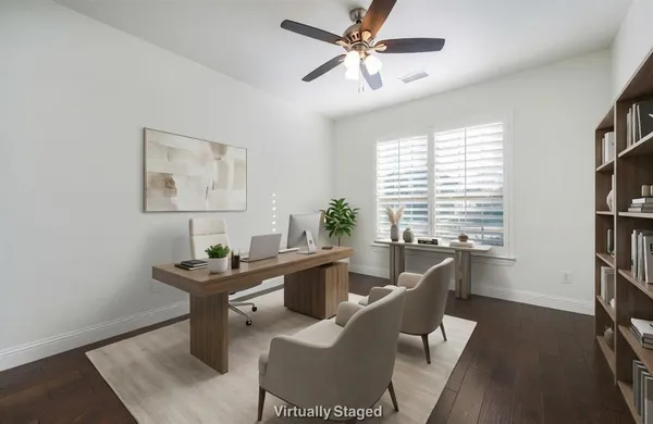 a dining room with wooden floor and a window