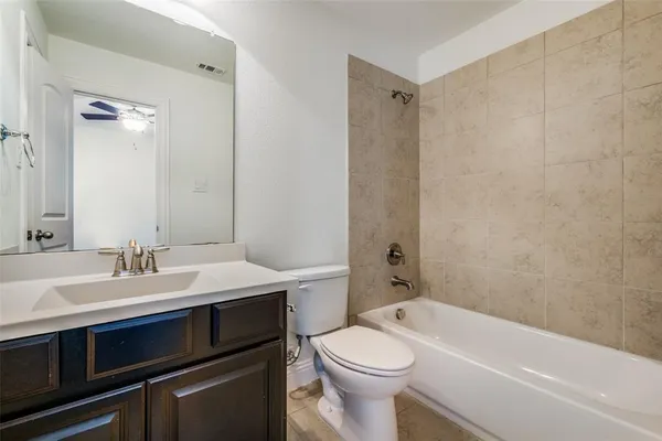 a bathroom with a sink a toilet and a bathtub