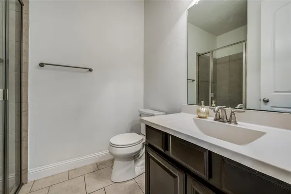 a bathroom with a sink toilet and vanity