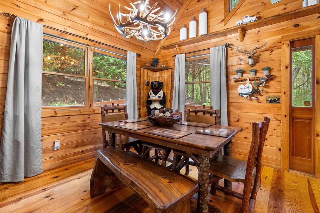 35 Wunder Bear Ridge Morganton, GA 30560 - Photo 15 of 76 a view of a dining room with furniture large windows and wooden floor