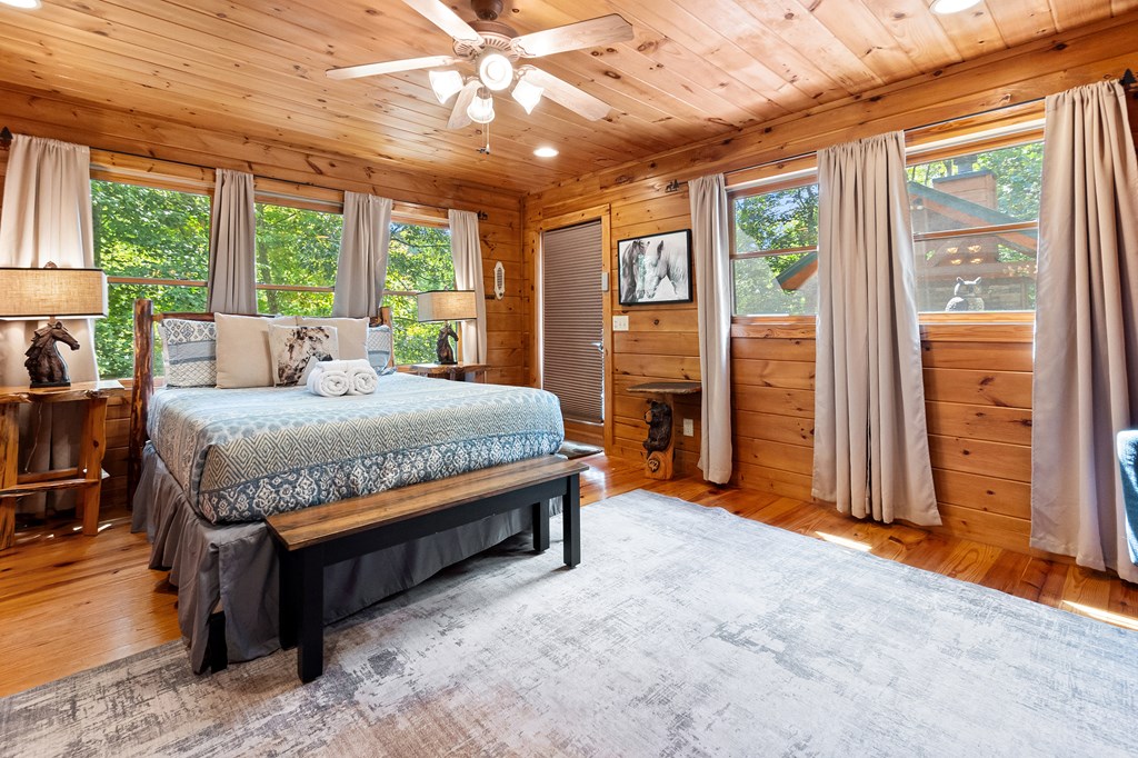 35 Wunder Bear Ridge Morganton, GA 30560 - Photo 22 of 76 a bedroom with a bed and large windows