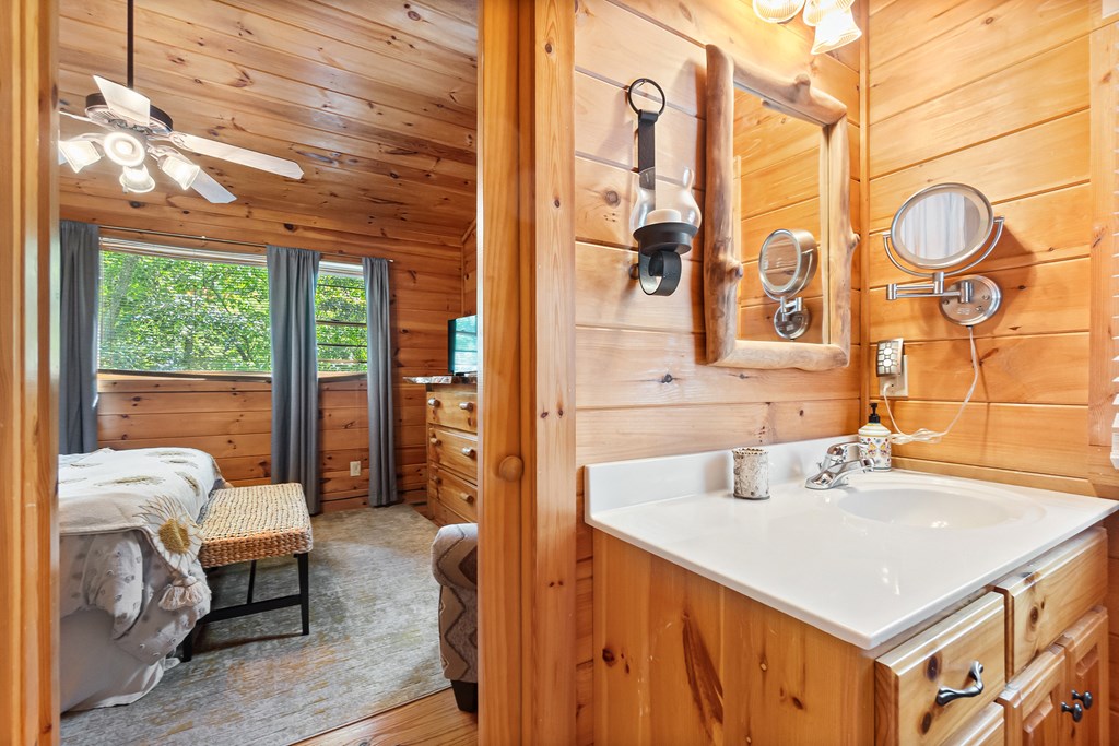 35 Wunder Bear Ridge Morganton, GA 30560 - Photo 29 of 76 a bathroom with a sink vanity and a mirror