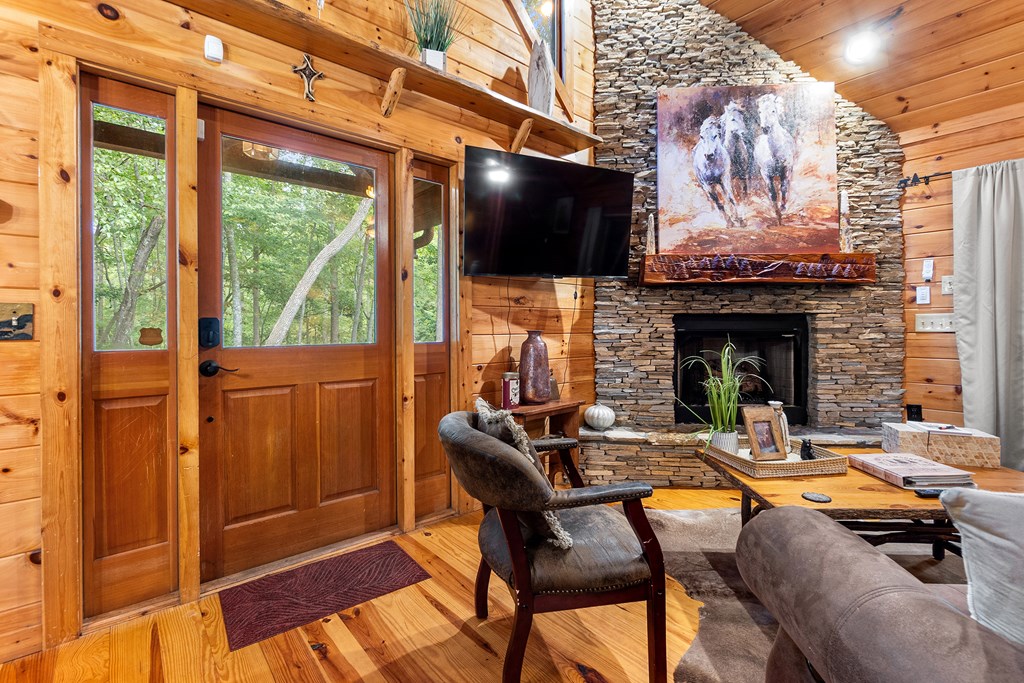 35 Wunder Bear Ridge Morganton, GA 30560 - Photo 10 of 76 a living room with furniture a fireplace and a flat screen tv