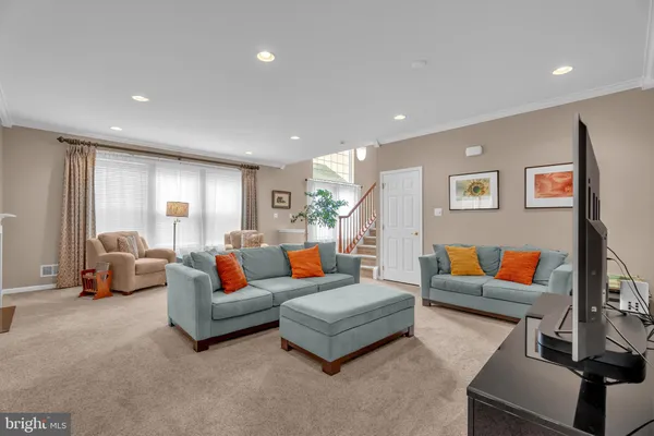 a living room with furniture and a couch