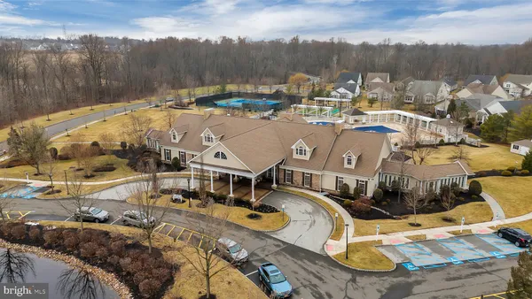 an aerial view of a house with a swimming pool