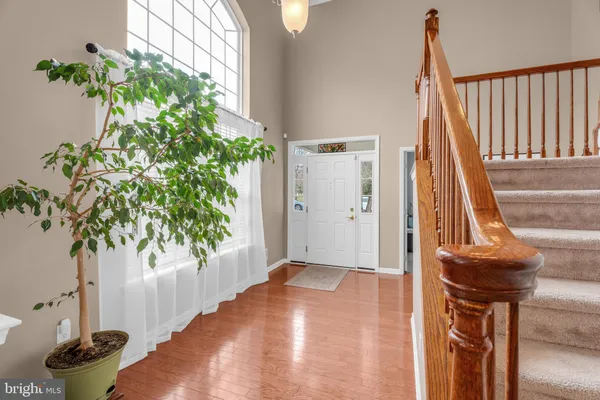 a view of entryway with wooden floor