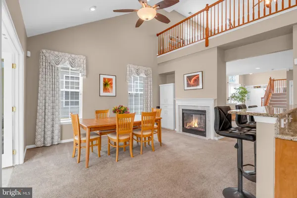 a view of a livingroom with furniture and a fireplace
