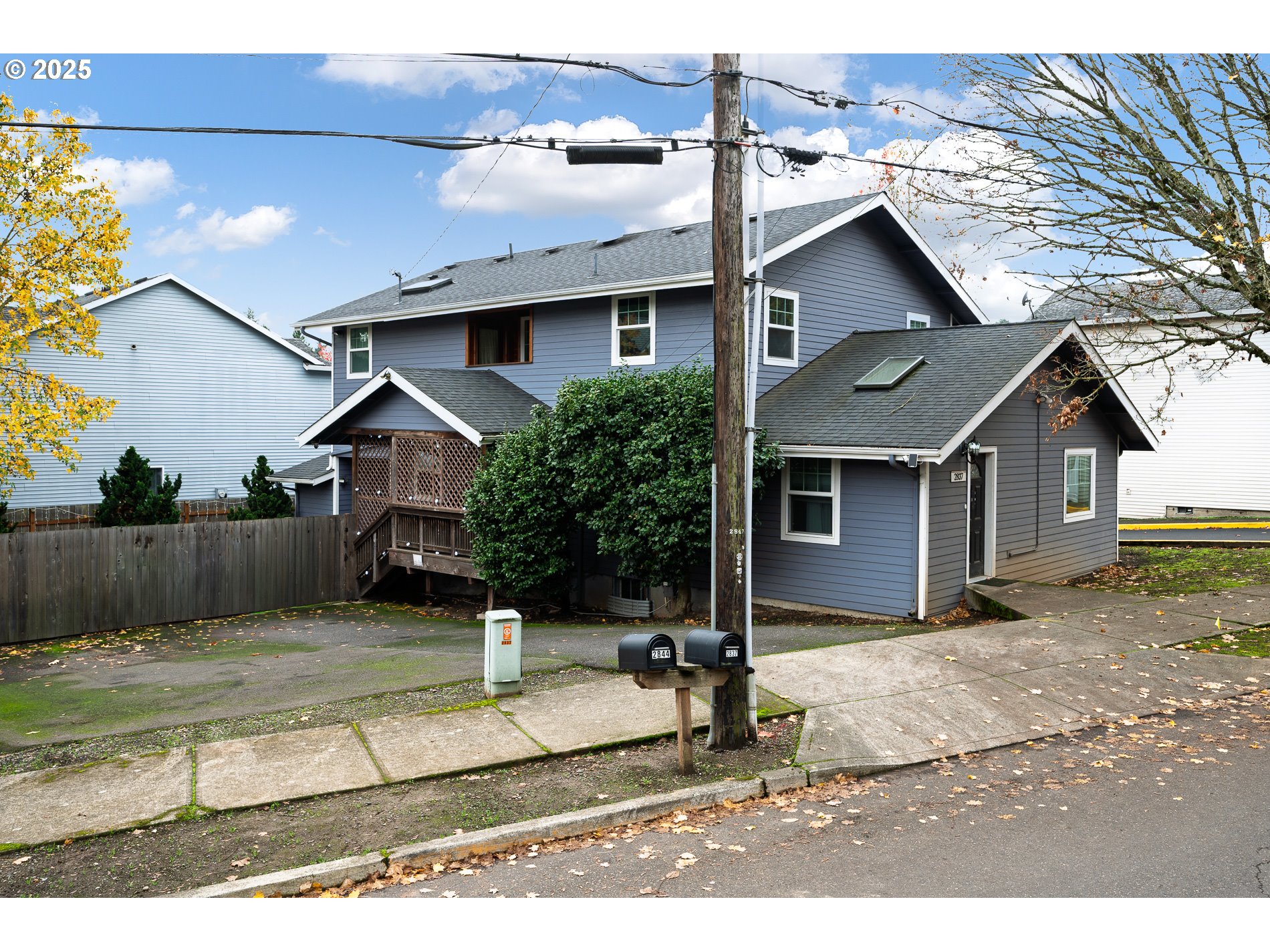 2837 Southeast 90th Place Portland, OR 97266 - Photo 2 of 40 a front view of a house with a yard and garage