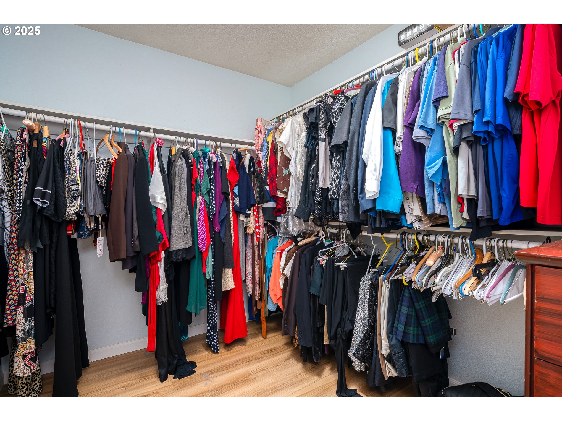2837 Southeast 90th Place Portland, OR 97266 - Photo 21 of 40 a view of walk in closet with clothes