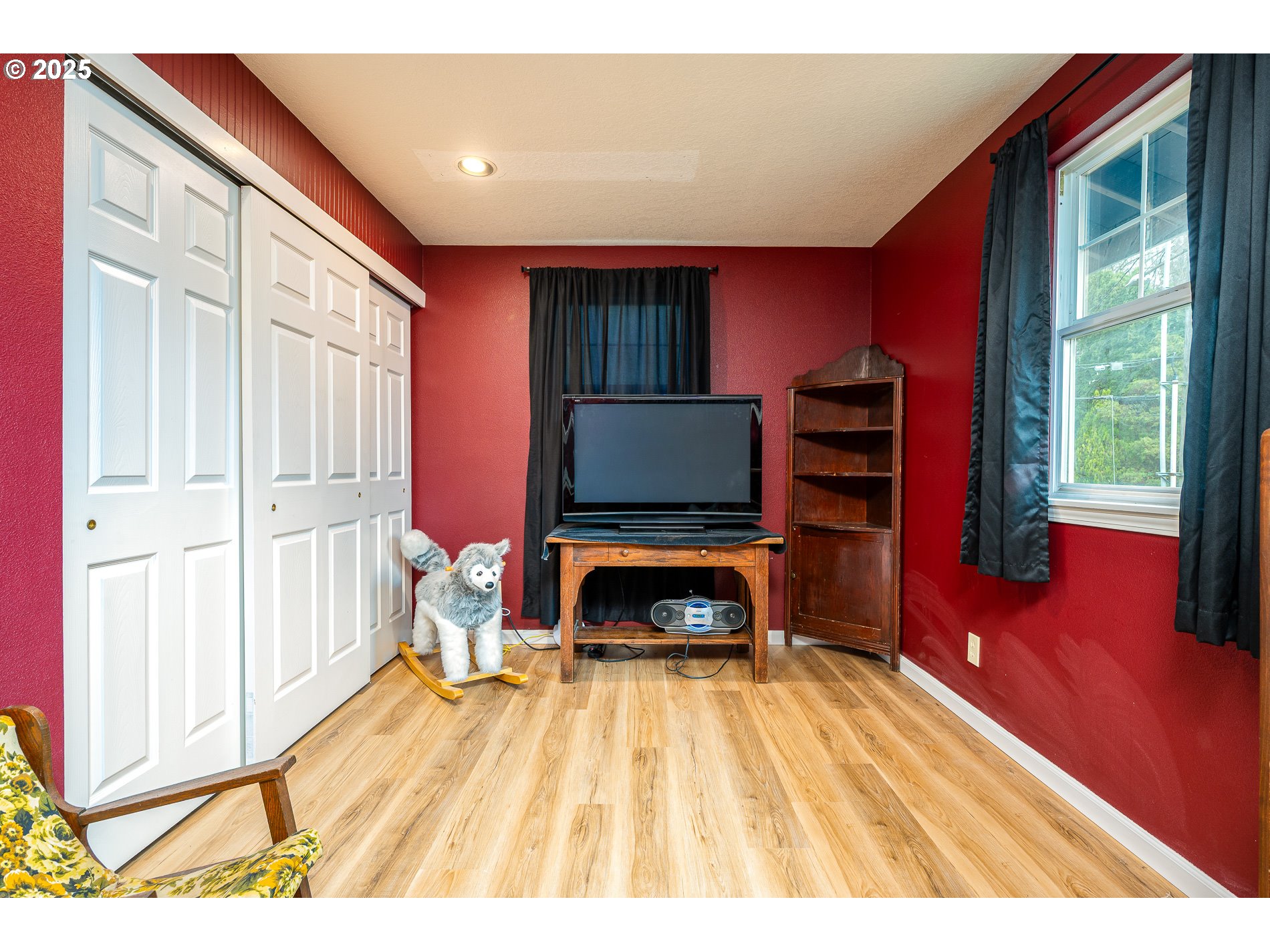 2837 Southeast 90th Place Portland, OR 97266 - Photo 27 of 40 a living room with a fireplace furniture and a flat screen tv
