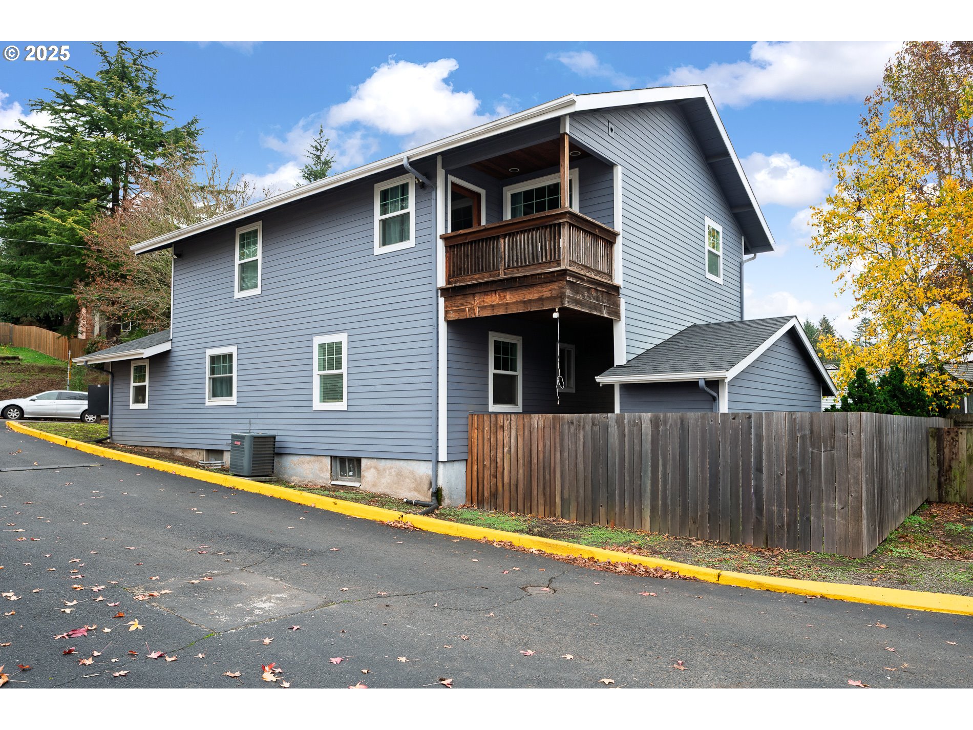 2837 Southeast 90th Place Portland, OR 97266 - Photo 32 of 40 a view of a house with backyard and trees in the background