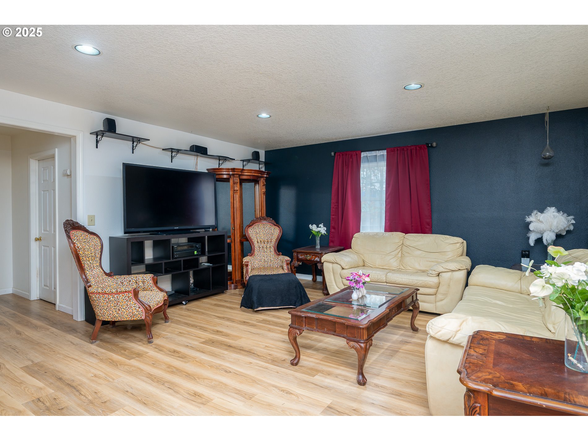 2837 Southeast 90th Place Portland, OR 97266 - Photo 7 of 40 a living room with furniture and a flat screen tv