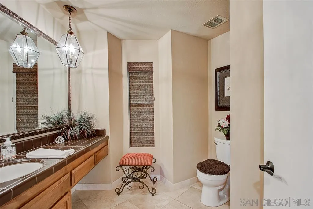 16508 Wilderness Road Poway, CA 92064 - Photo 15 of 25 a very nice looking room with a large window and chandelier