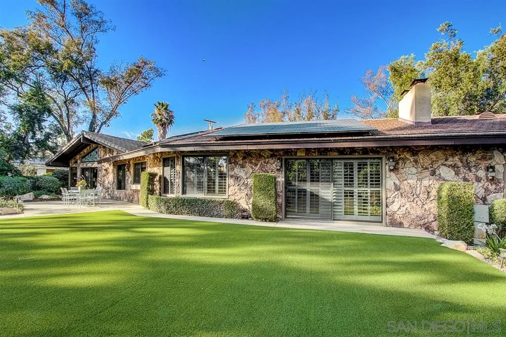 16508 Wilderness Road Poway, CA 92064 - Photo 20 of 25 a front view of a house with a garden