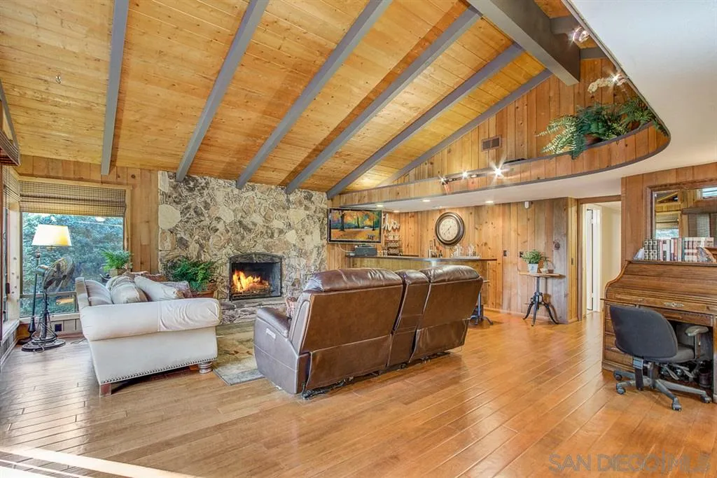 16508 Wilderness Road Poway, CA 92064 - Photo 5 of 25 a living room with furniture and a fireplace