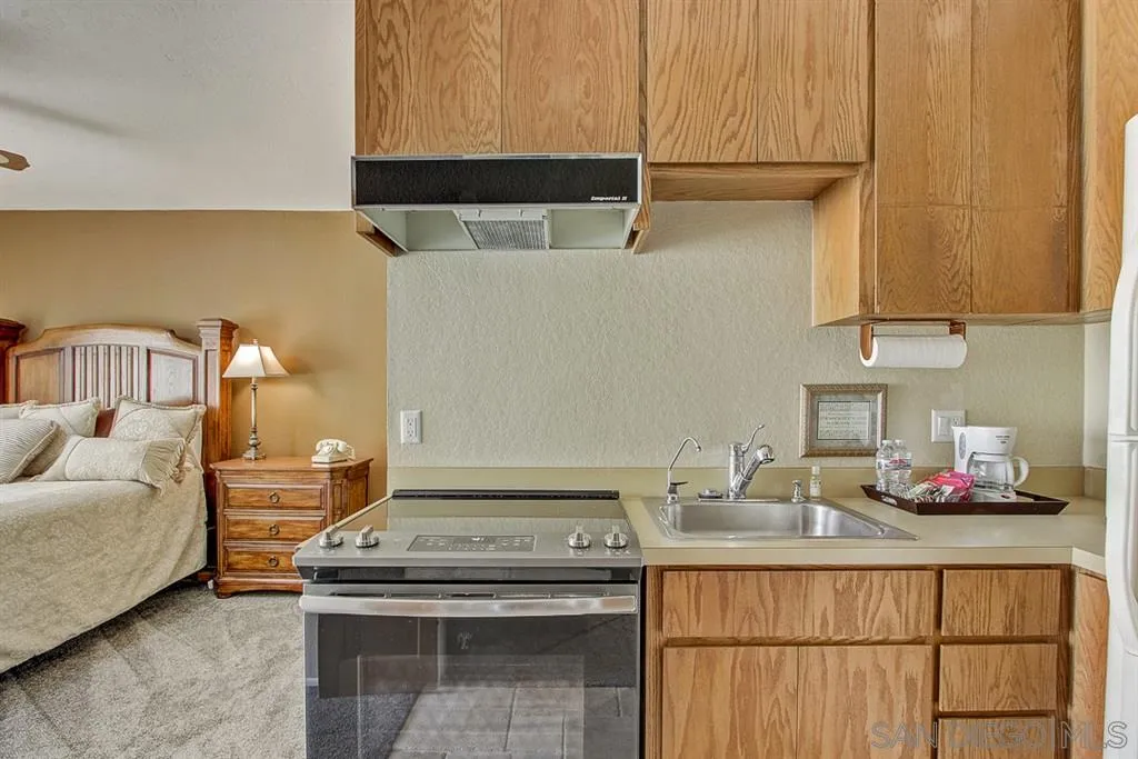 16508 Wilderness Road Poway, CA 92064 - Photo 7 of 25 a kitchen with a sink and cabinets