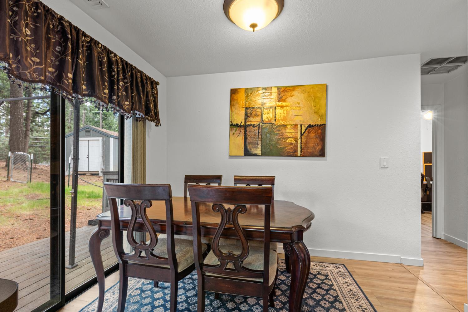 5680 Azalea Circle Pollock Pines, CA 95726 - Photo 11 of 31 a view of a dining room with furniture and window