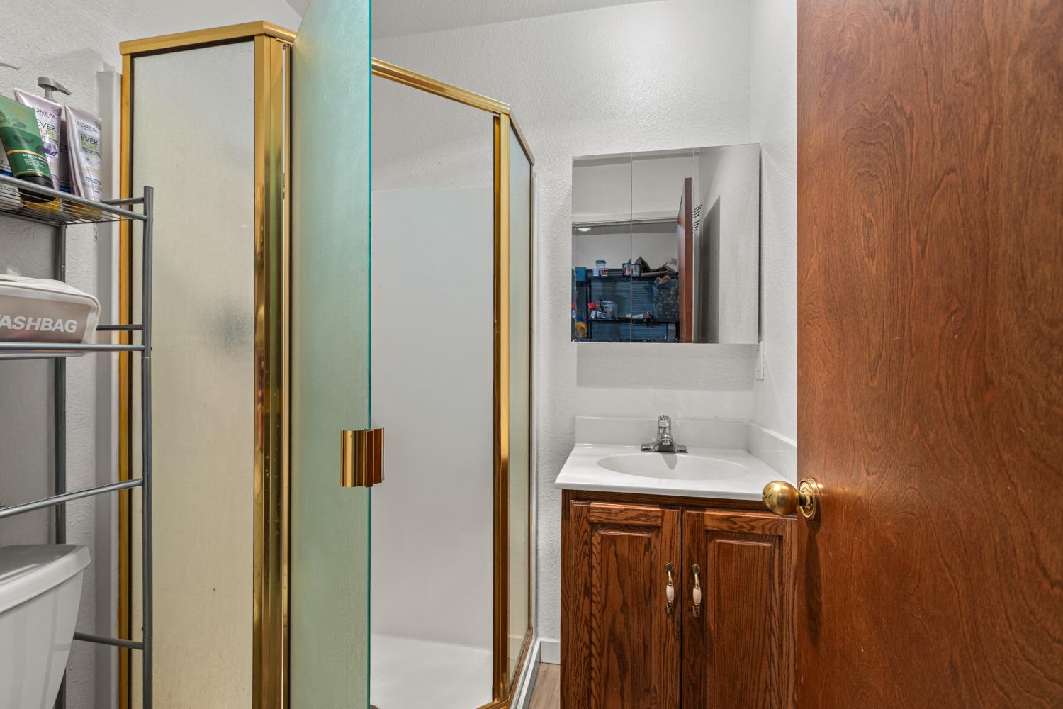 5680 Azalea Circle Pollock Pines, CA 95726 - Photo 13 of 31 a bathroom with a sink and a mirror