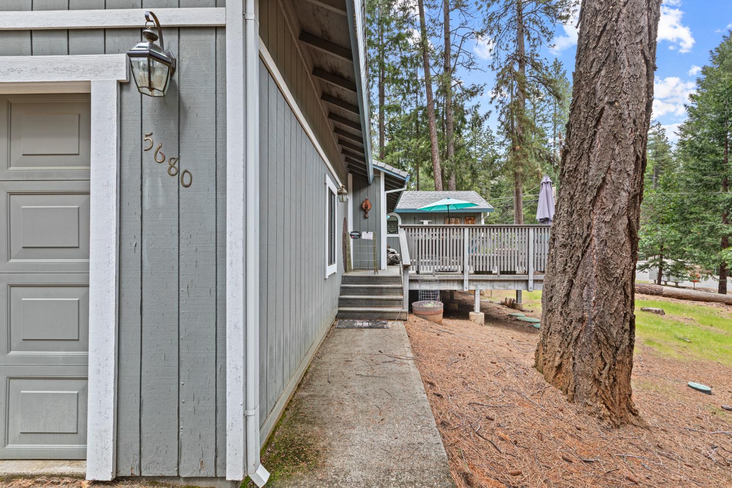 5680 Azalea Circle Pollock Pines, CA 95726 - Photo 21 of 31 a view of a porch with couches and fire pit