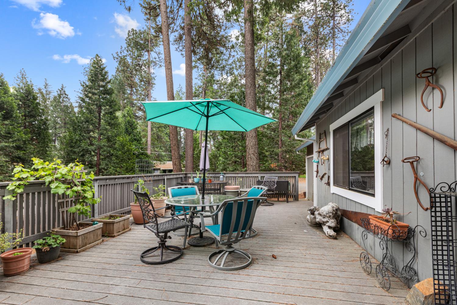 5680 Azalea Circle Pollock Pines, CA 95726 - Photo 24 of 31 a view of table and chairs under an umbrella