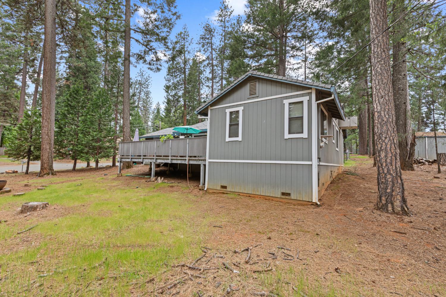5680 Azalea Circle Pollock Pines, CA 95726 - Photo 26 of 31 a view of a house with a yard covered in snow