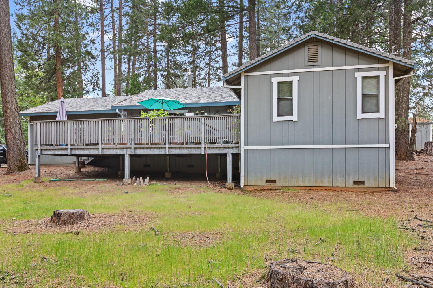 5680 Azalea Circle Pollock Pines, CA 95726 - Photo 27 of 31 a view of a house with backyard and trees
