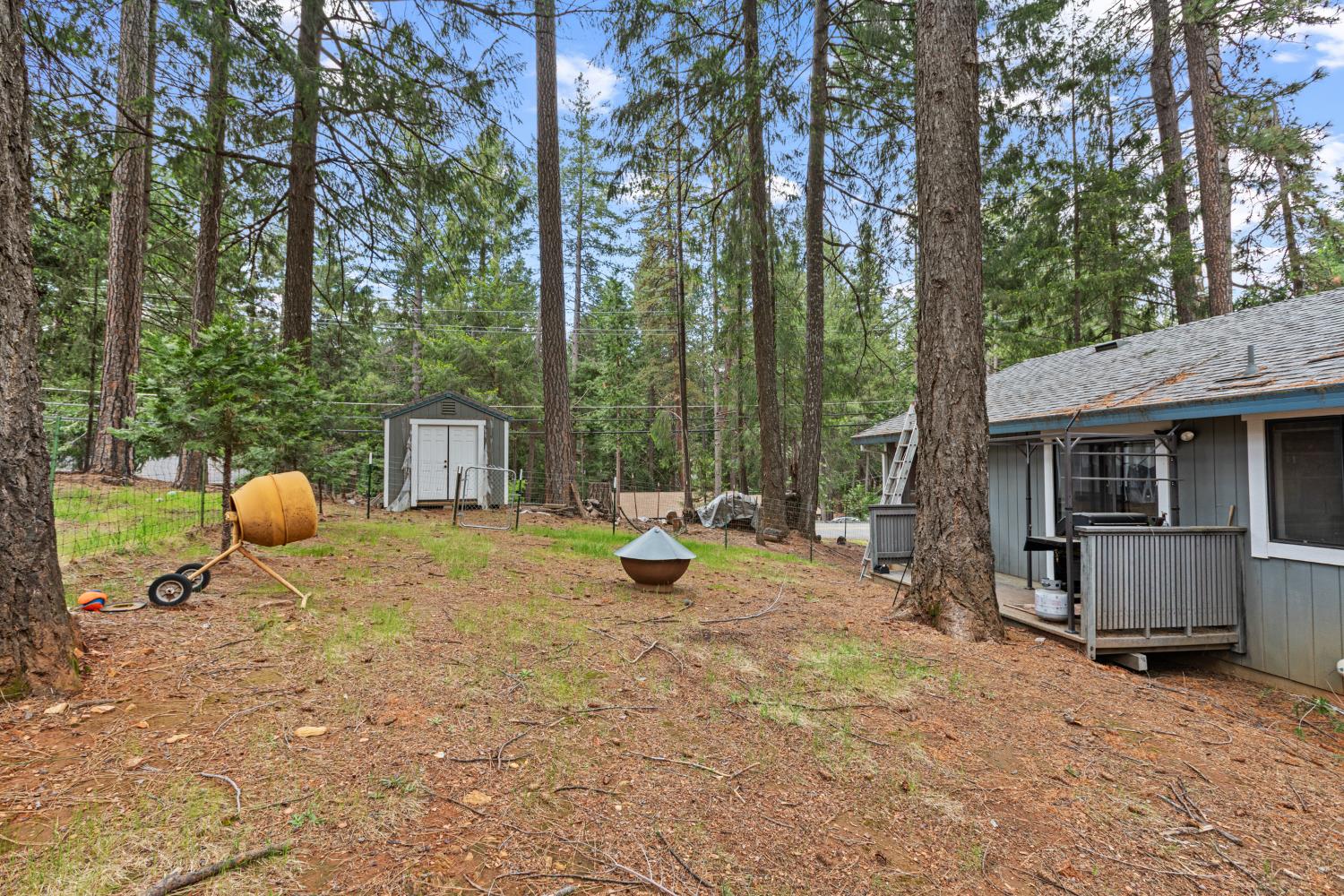 5680 Azalea Circle Pollock Pines, CA 95726 - Photo 28 of 31 a view of a backyard with table and chairs