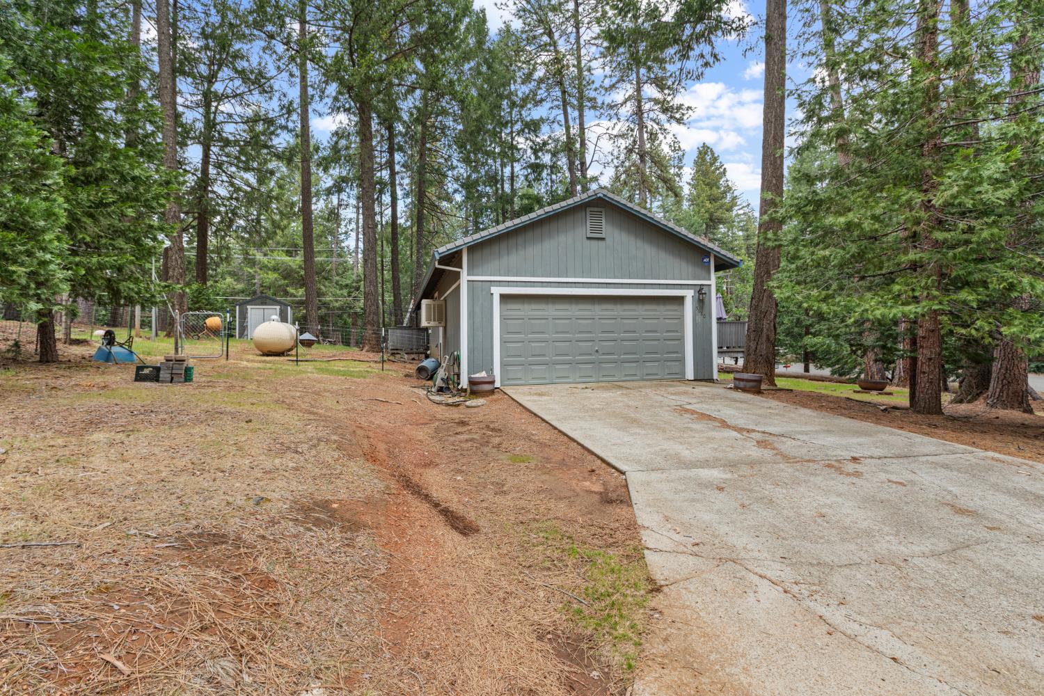 5680 Azalea Circle Pollock Pines, CA 95726 - Photo 30 of 31 a view of a house with a outdoor space