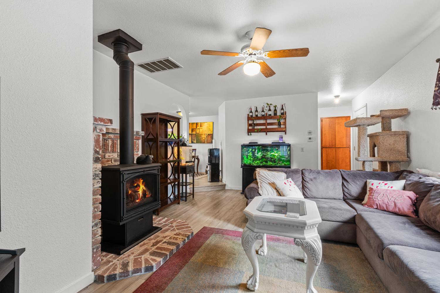 5680 Azalea Circle Pollock Pines, CA 95726 - Photo 6 of 31 a living room with furniture and a fireplace