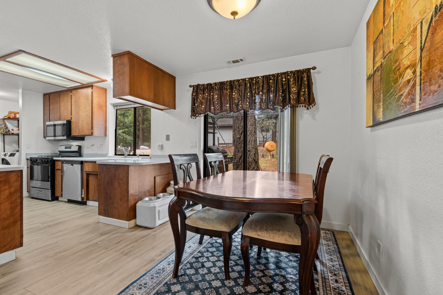 5680 Azalea Circle Pollock Pines, CA 95726 - Photo 8 of 31 a dining room with furniture and window