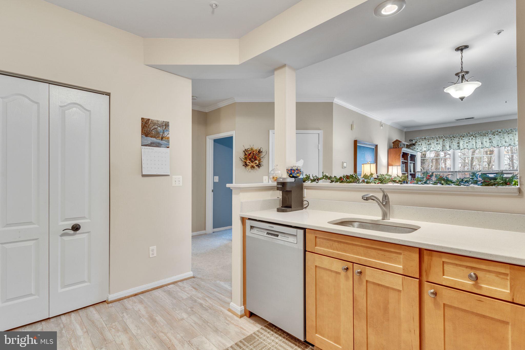 7706 Haynes Point Way, Unit 8F Alexandria, VA 22315 - Photo 12 of 36 a kitchen with a sink and cabinets