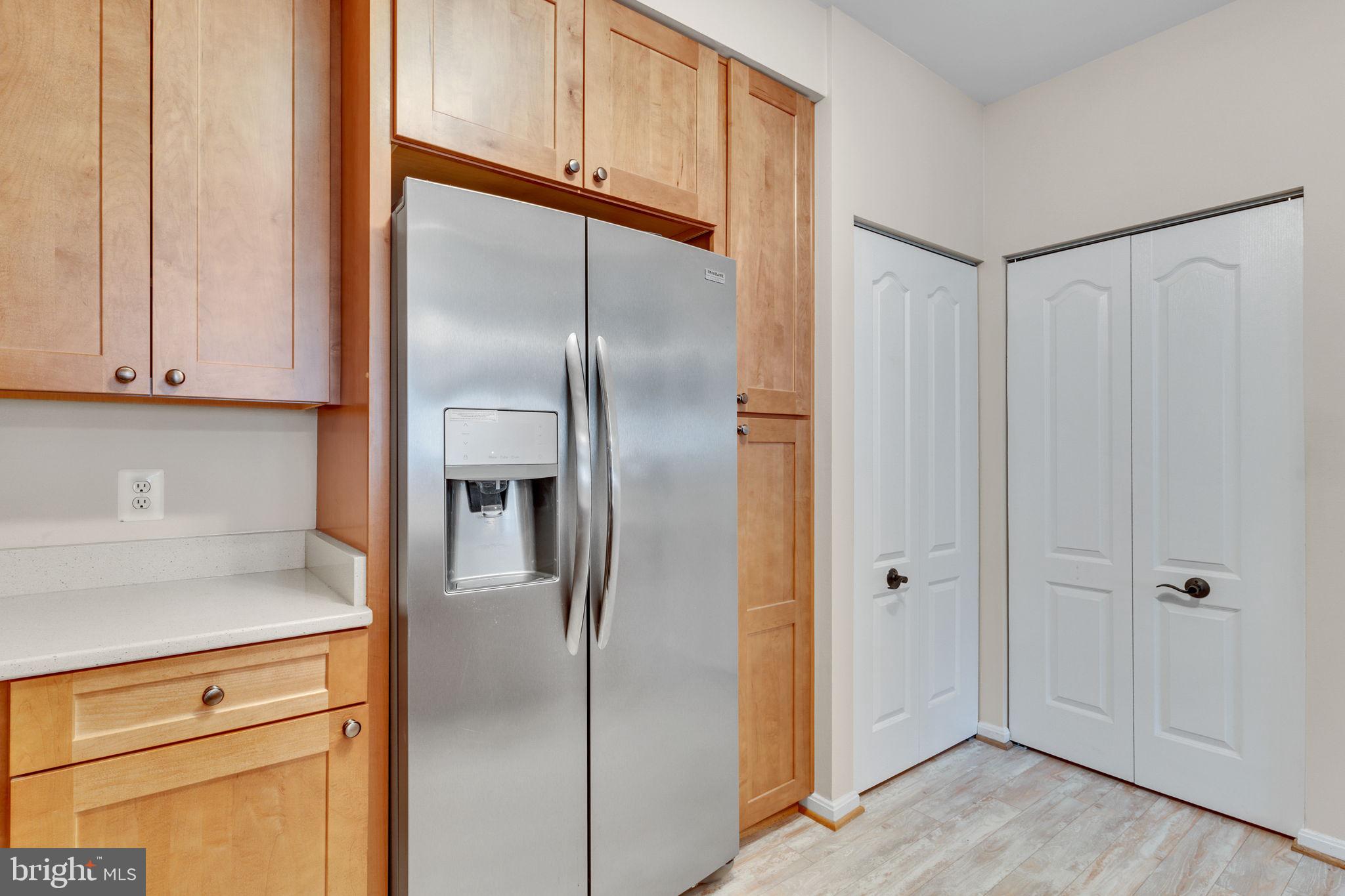 7706 Haynes Point Way, Unit 8F Alexandria, VA 22315 - Photo 13 of 36 a metallic refrigerator freezer sitting in a kitchen